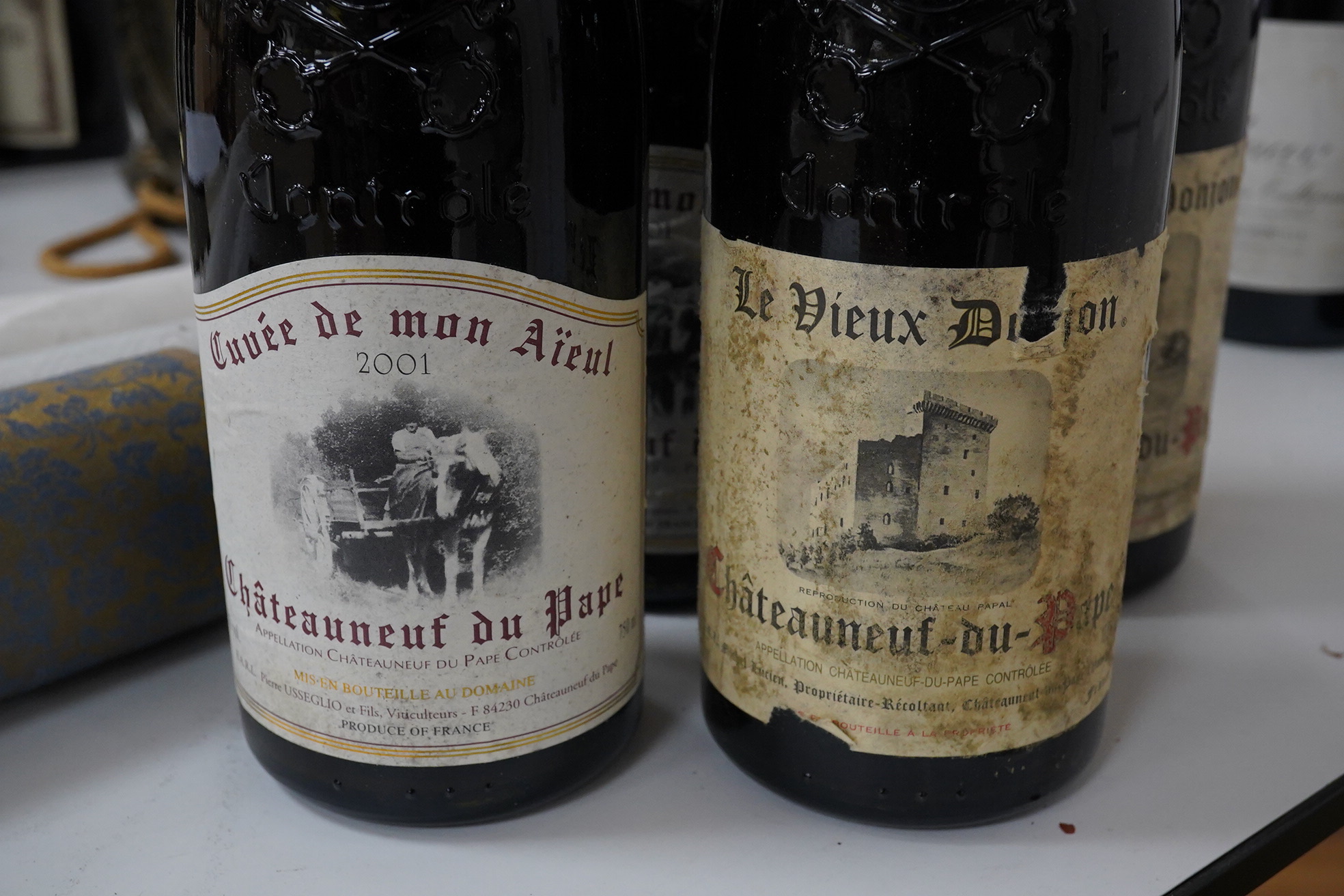 Two bottles of Chateauneuf du Pape, Le Vieux Donion, (no year) and two bottles of Chateauneuf du Pape, 2001, Cuvee demon Aieul. Condition - fair/good